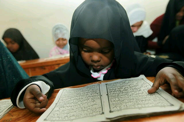Kenya Child Reading the Qur'an